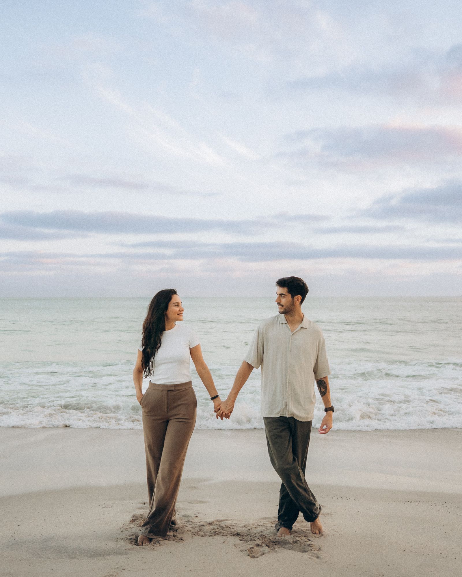 Luis & Judith walking on the beach