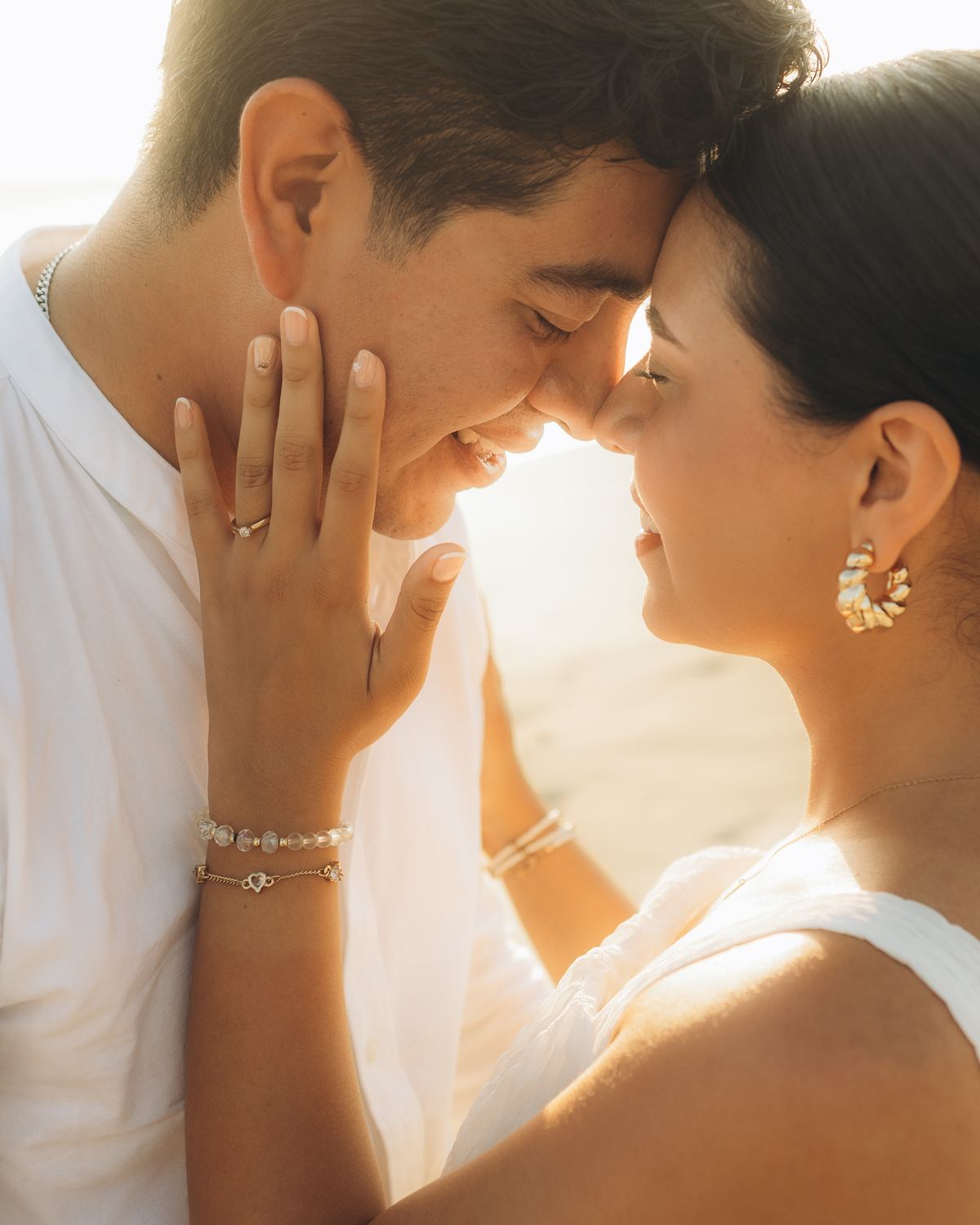 Couple forehead to forehead at sunset