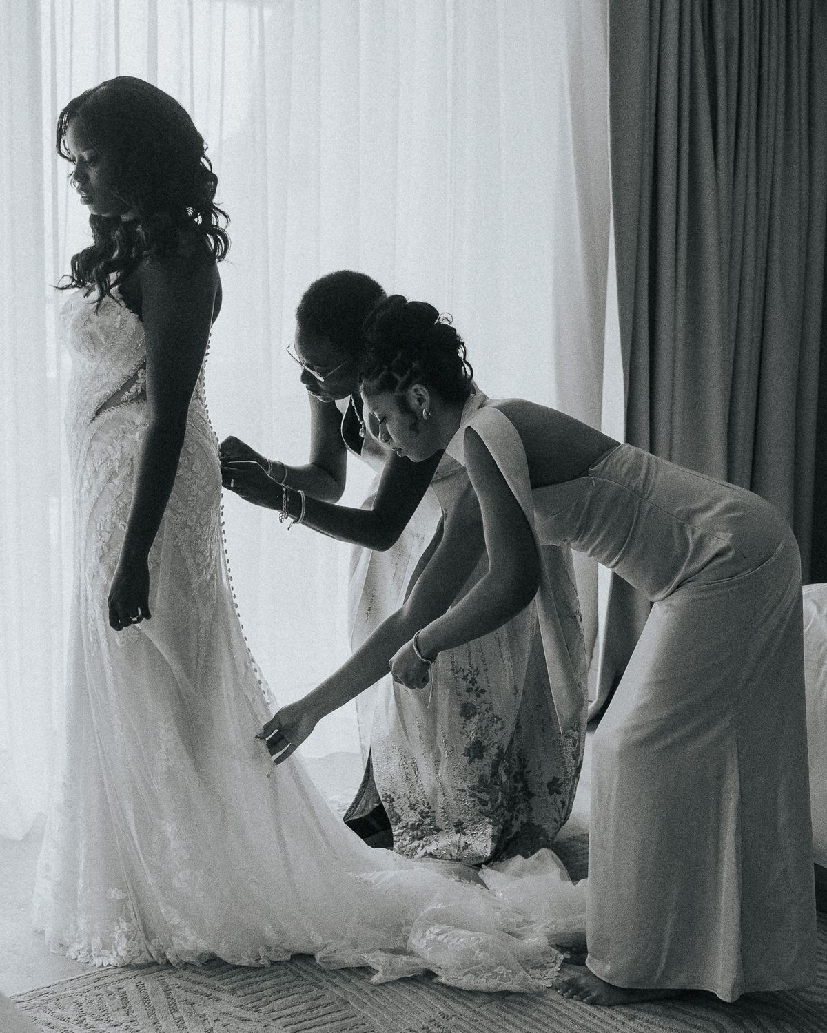 Bride getting into her dress